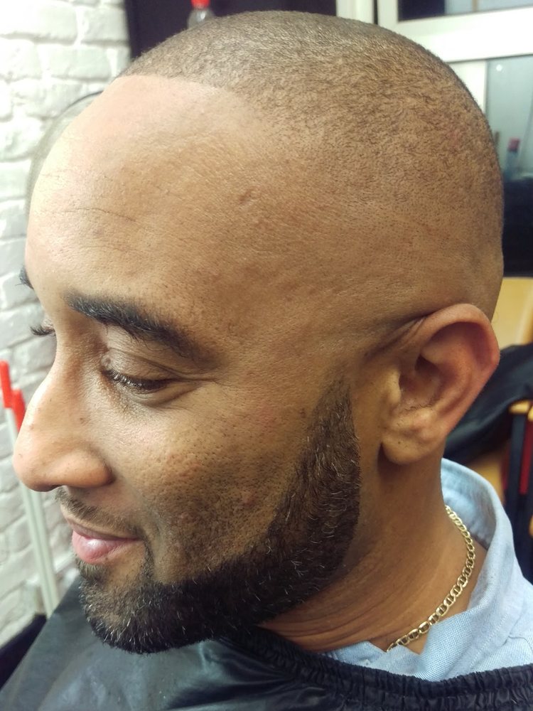 Skin fade with lined-up beard at Otis Barbers